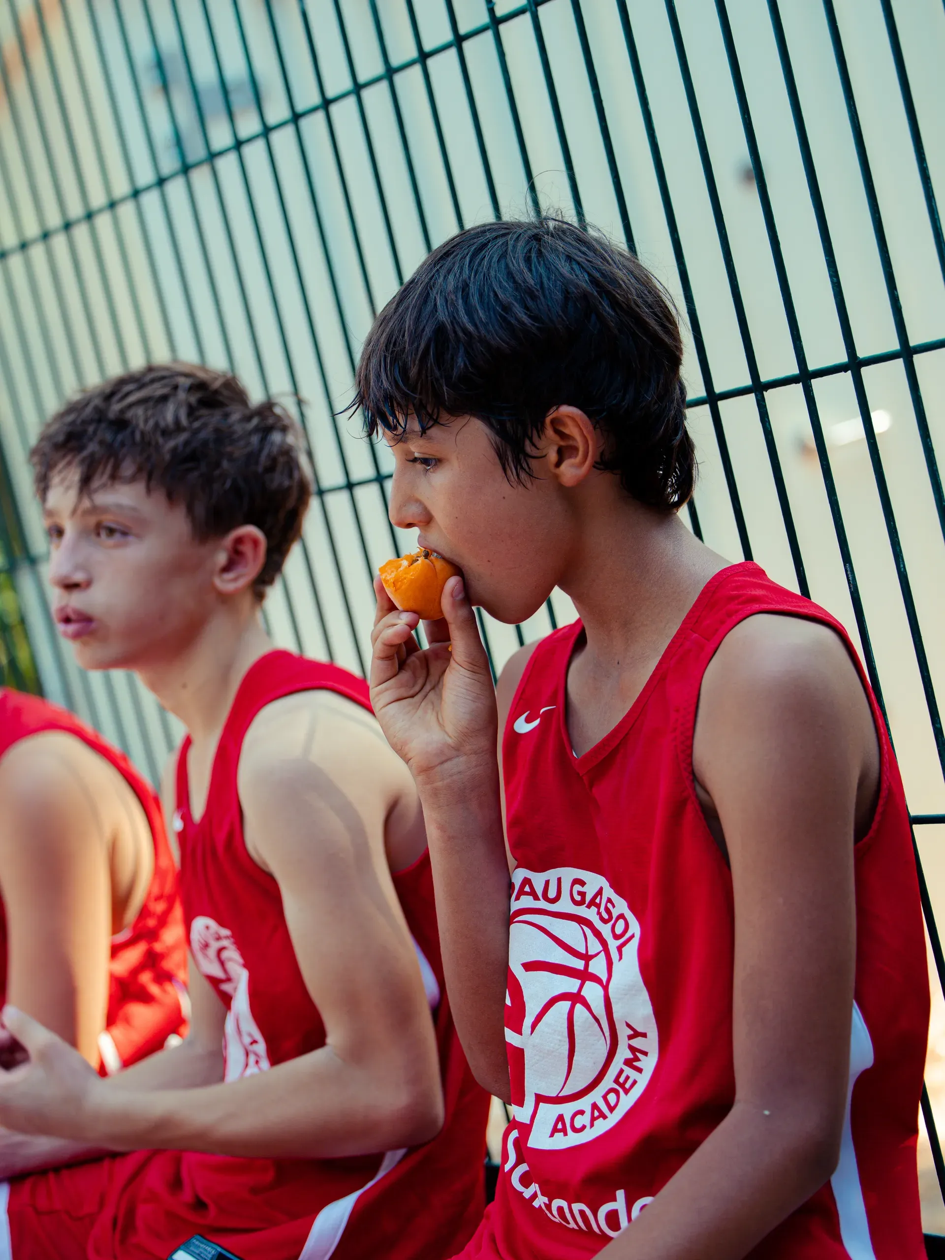 Young players eating fresh fruit during the Academy